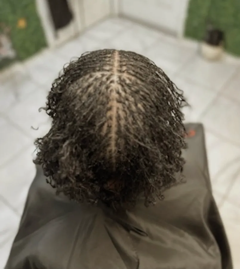 Curly microlocks with a centre parting
