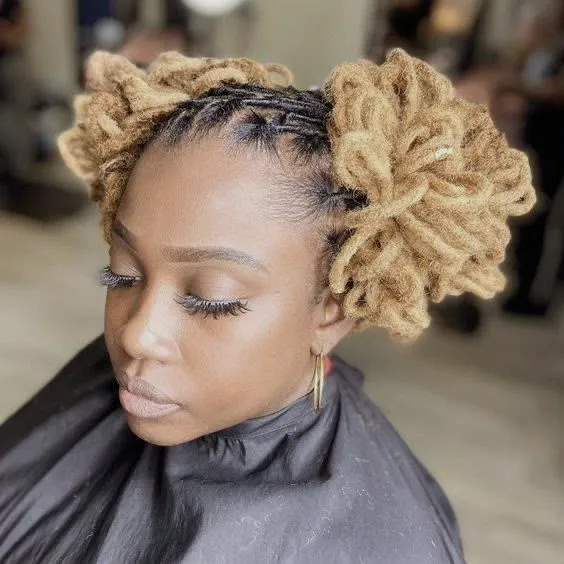 Loc updo with golden tips by D&Daughters
